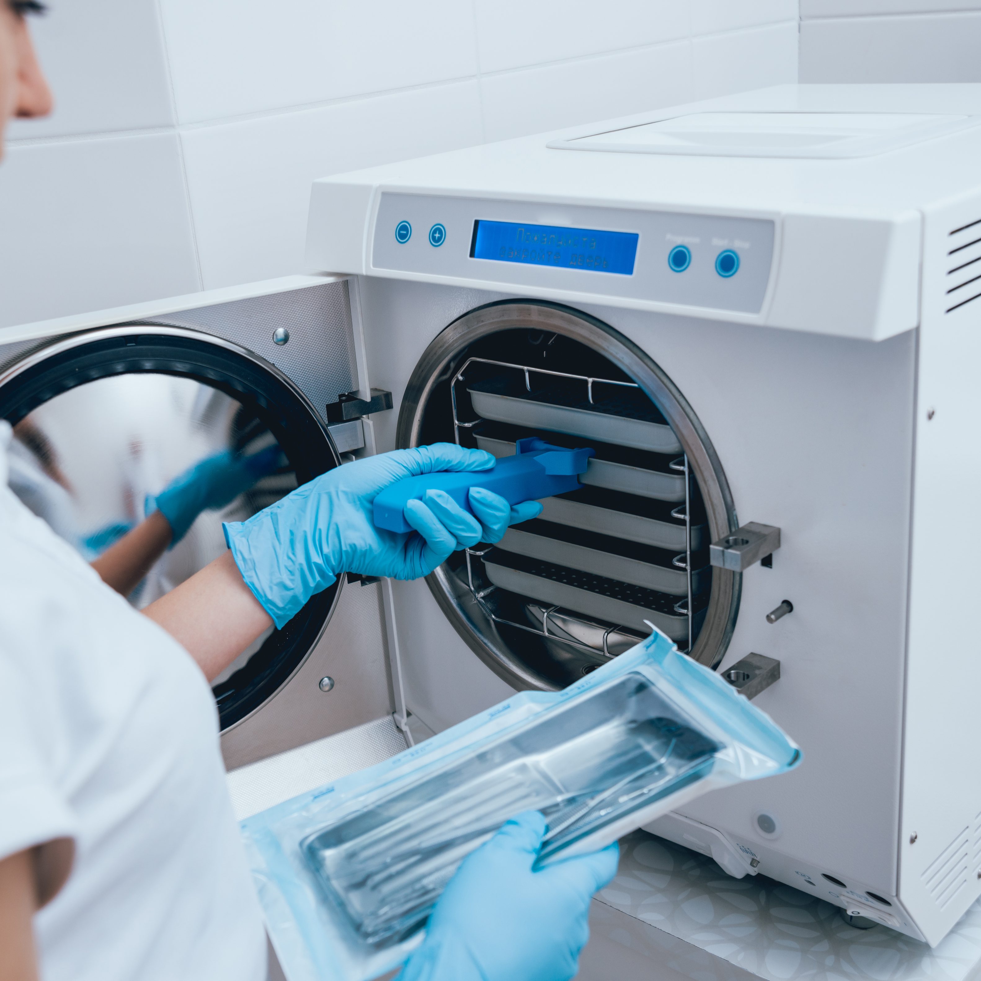 Sterilizing medical instruments in autoclave. Dental office